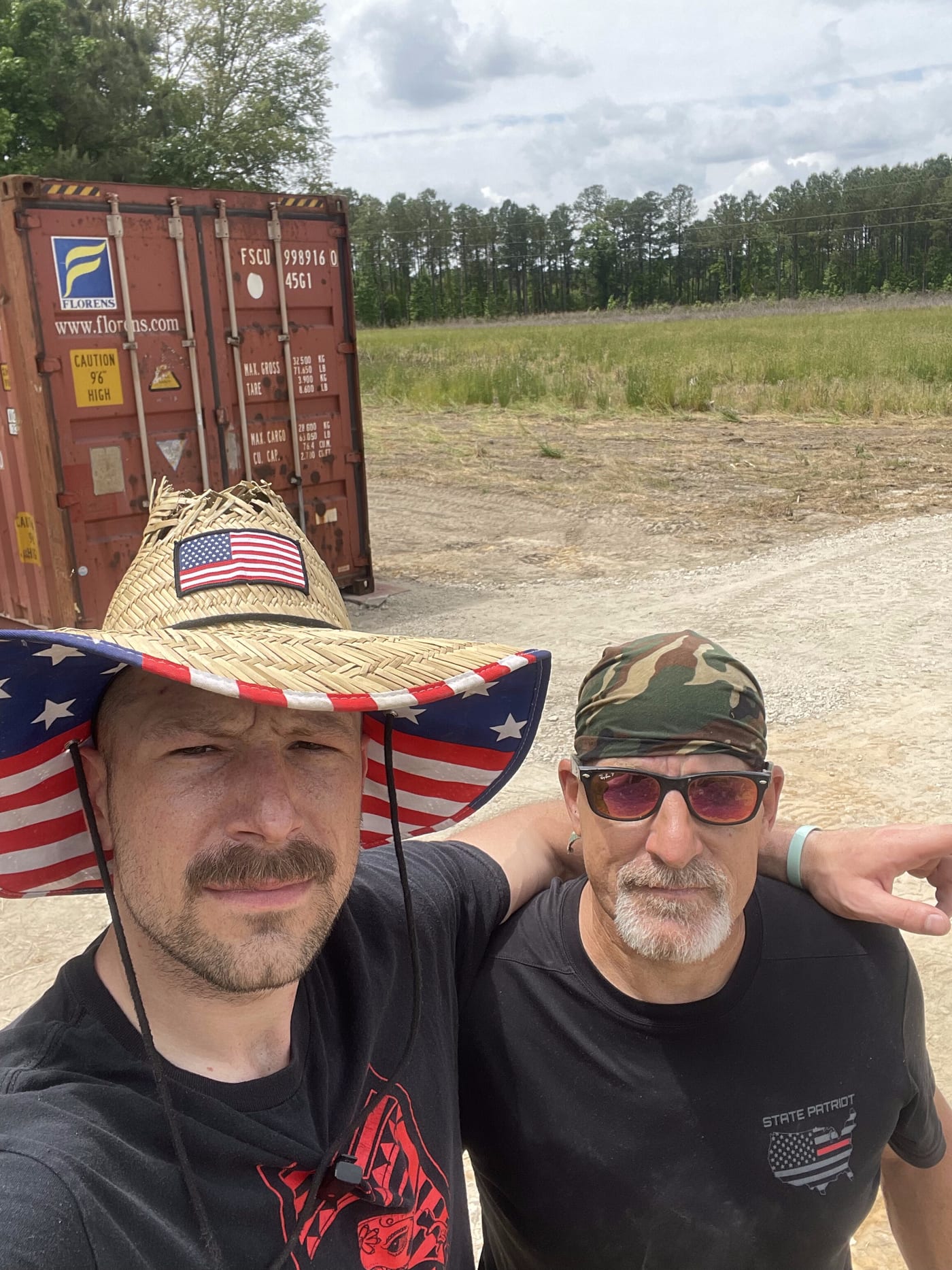 Kyle and his dad standing on the 25-acre parcel in Lake City, South Carolina